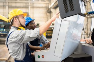 two production workers working together