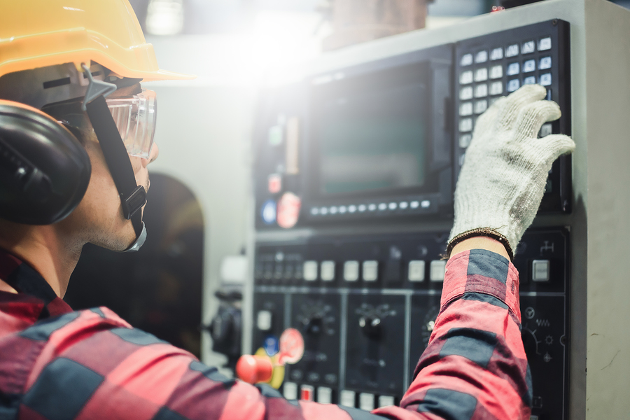 picture of technician working a niche position in MFG