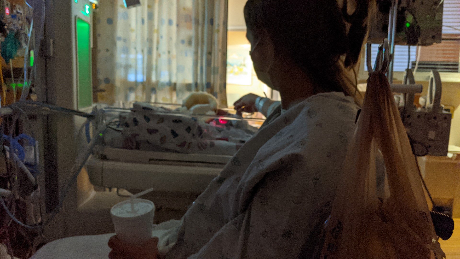 Becky holding Wyatts hand in the NICU