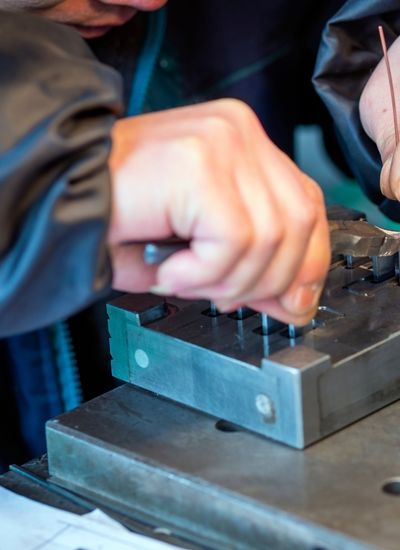 Manual Machinist working on a part