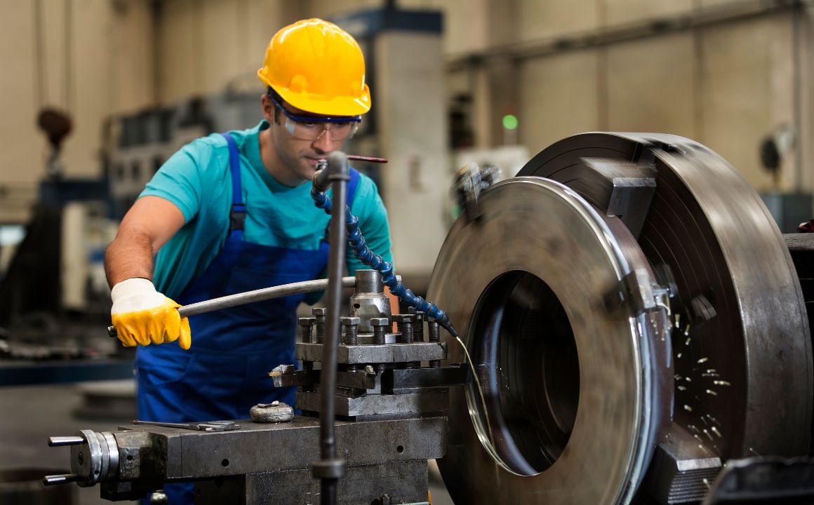 Metal fabricator working on part